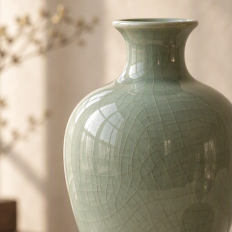 The shoulder and neck of a crackle-glazed celadon vase